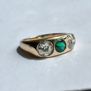 Antique Emerald and Diamond Three Stone Gypsy Ring set in 18ct Yellow Gold. The diamonds are transitional brilliant cut 1.4ct weight. The central emerald is Edwardian cut. The ring is currently UK size Q but can be resized. 