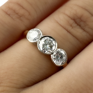 Millennium 1.27ct 3 Stone Diamond Ring on finger 18ct