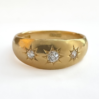 Glowing Antique Three Diamond Gypsy Ring.Beautiful sparkling star set old cut diamonds 0.40ct diamond weight set in 18ct yellow gold.The ring has a makers mark 'AA TW' with a London 1897 hallmark.An easy to wear and low on the finger ring.UK size O1/2,can be resized preserving the hallmark.Please contact us if you would like further information about this ring or assistance or advice about the process of buying this ring.