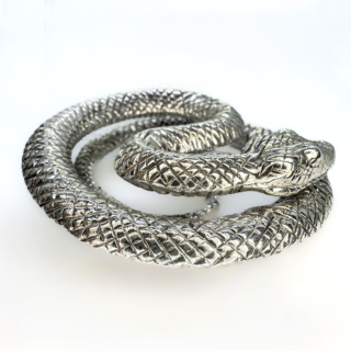 Mesmerising Coiled Silver Snake Objet d Art.A really eyecatching ornamental textured snake,rising up in coils from his tail.An unusual collectable piece.He has a full hallmark London 2010.A must for snake lovers.Measuring 5.5 x 4.5 x 1.2cm.Fine detail to the head and body.Please contact us if you would like further details on this silver snake