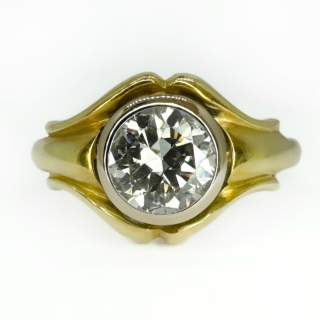 Unique Bezel Set Edwardian 1.2ct Diamond Single Stone Ring.The 1.2ct transitional cut diamond is set in 18ct yellow gold,the shoulders are sweeping around the bezel set diamond.The diamond is G-H colour and the clarity is VS2.A beautiful single stone ring.The ring can be resized.Please contact us if you would like to know more about this ring.