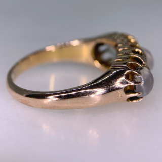 Stunning Edwardian Moonstone and Diamond Half Hoop in 18ct Rose Gold, Hallmarked Birmingham. This rare half hoop holds three cabochon Moonstone. The centre stone measures approximately 5 mm in diameter, the two side stones measure 3.8 mm in diameter, six rose cut diamonds with the diameter of 1.5 mm each separate the moonstones. All the stones are claw set in a decorative gallery 4 mm in depth, the shoulders run into a smooth polished half round shank, circa the Edwardian era. The ring is in excellent condition.