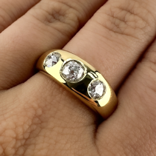 Beautiful Victorian 3 Stone Gypsy Ring 1.50ct. Hallmarked in the shank to 1897 Birmingham this wonderful gypsy ring has 3 victorian old cut diamonds set in an 18ct yellow gold shank. The sparkly diamonds are VS1 in clarity and H-I in colour with a total diamond weight of 1.50cts. Please contact us if you would like to know more about this lovely gypsy ring or visit us at Saddingtons Jewellery, Mayfair.