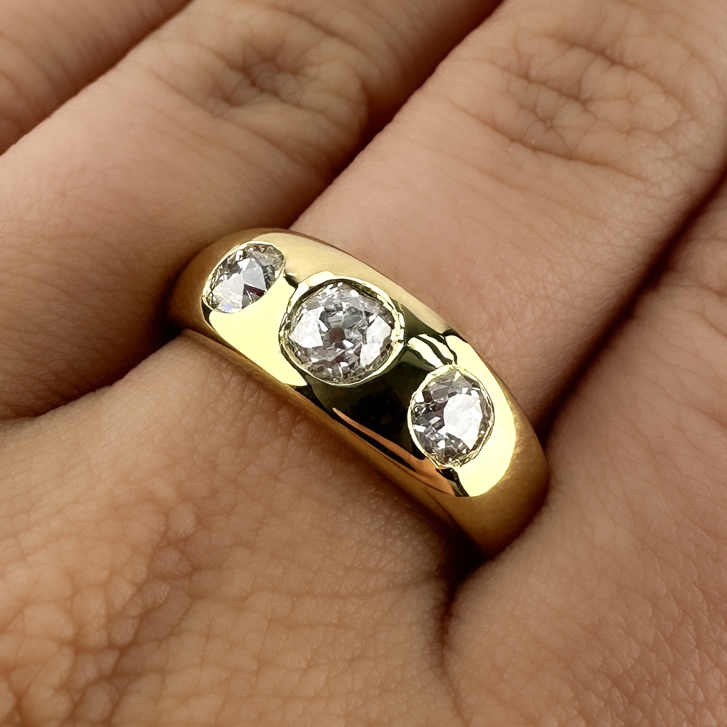Beautiful Victorian 3 Stone Gypsy Ring 1.50ct. Hallmarked in the shank to 1897 Birmingham this wonderful gypsy ring has 3 victorian old cut diamonds set in an 18ct yellow gold shank. The sparkly diamonds are VS1 in clarity and H-I in colour with a total diamond weight of 1.50cts. Please contact us if you would like to know more about this lovely gypsy ring or visit us at Saddingtons Jewellery, Mayfair.