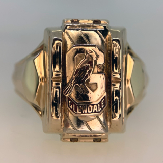 Incredible Glendale College USA Ring in 10ct Hallmarked Yellow Gold, 1955. This heavy solid gold ring is decorated with a mascot bird, the name Glendale and the year of graduation, all in coloured enamel.  The style of the ring is circa many American college rings, with a dog head look about it. The head of the ring measures approximately 17.5 mm x 12 mm. The ring is in great excellent condition, with a few minor sections of enamel missing. the ring is heavy on the hand with a polished shank.