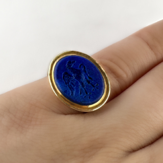 Brilliant Lapis Griffin Intaglio Signet Ring. This wonderful ring features lapis lazuli set in yellow gold with a griffin carved into the gemstone. The griffin is a symbol of bravery, protection and power. This ring can be resized. Please contact us if you would like to know more about this ring or visit us at Saddingtons Jewellery, Mayfair.