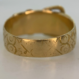 Stunning Rose Vine Chased Buckle Ring in 18ct Yellow Gold, Hallmarked Birmingham, 1887. The ring is decorated with roses and thorns, the buckle itself and the inner shank is polished, it is likely the roses signify the year of Queen Victorias Golden Jubilee. The buckle width is 11 mm and the band width measures 8 mm. The ring tapers towards the back, the back of the ring is slightly worn, with the rose detailing rubbed off, however overall an excellent antique ring in good condition. The date of this ring correlates to Queen Victorias Golden Jubilee.  