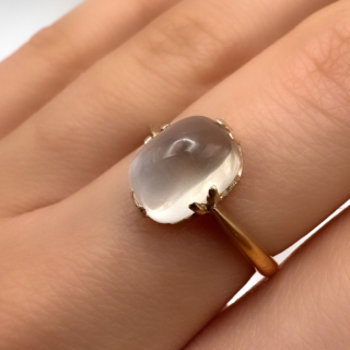 Dreamy Single Stone Moonstone Cabochon Ring.The single stone gray white cabochon moonstone is claw set in a buttery yellow gold mount.UK ring size K,this lovely ring can be resized.Please contact us if you would like to know more about this ring.