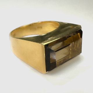 Truly Funky 1970's Smokey Quartz Rectangular Chunk Ring.Set in chunky 14ct yellow gold the smokey quartz glows with hues of golden brown.Total vintage boldness.UK ring size K1/2 with the hallmark in the shank.The ring can be resized.Please contact us if you would like to know more about this ring.