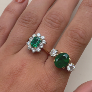 Outstanding Emerald and Diamond Rectangular Cluster Ring in 18ct Yellow Gold, Hallmarked London, 1990. The exquisite ring has a 1.4carat immaculate glowing emerald as a centre stone, surrounded by 1.02carats of brilliant cut, bright white diamonds (total diamond weight). All the stones are claw set in a platinum basket, with a reverse taper, raised flat band shank. The head of the ring measures approximately 14 mm x 12.5 mm. The ring is in absolutely immaculate condition.