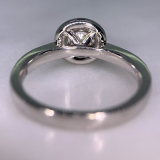 Incredible Diamond Halo Cluster Ring in 950 Platinum. The exquisite halo ring has a 0.63carat centre diamond, claw set with diamond halo. The head of the ring measures 9 mm in diameter with 12 diamond embellished shoulders. The ring has a flat sided-court shank, polished. All the stones are claw set. The ring is in absolutely immaculate condition.