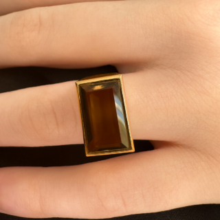 Truly Funky 1970's Smokey Quartz Rectangular Chunk Ring.Set in chunky 14ct yellow gold the smokey quartz glows with hues of golden brown.Total vintage boldness.UK ring size K1/2 with the hallmark in the shank.The ring can be resized.Please contact us if you would like to know more about this ring.