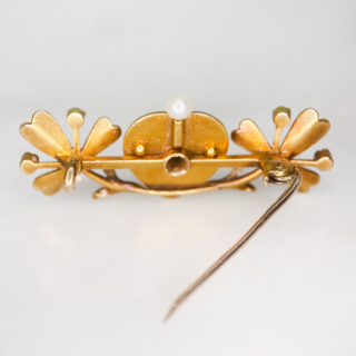 Much desired Victorian Blue Enamelled Heart and Clover Brooch, in 15  carat tested yellow gold.  Rich dark blue enamel heart with central old cut diamond and single pearl crown.  The heart is nestled between two pearl set clover leaves.  The clovers have chased leaf detail with seed pearl accents.  The whole brooch measures approximately 38mm x 16mm, all stones are claw set.  The rear of the brooch has a 15carat gold pin and C clasp with no safety catch.   The brooch would have possibly been a gift given from the heart to bring good luck to the recipient.  In immaculate condition, showing a small surface scratch to the bottom of the blue heart  in keeping with the age of the brooch.