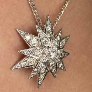 Dazzling, Mesmerising Diamond Star Pendant, in 15ct white gold, tested. A striking vintage natural diamond pendant with a total diamond weight of 2.35 cts. The diamonds are pave set and bright brilliant cut. The style is classic and timeless. The length including the bale is 1.5 inches and 1.2 inches to the widest star points wide. There are 3 stars in descending order giving a 3 dimensional effect. Contact us for further information, we can send a video on request. White gold chain is not included but we have a selection of white gold chains, please ask for details.