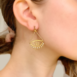 Incredible Pearl and Filigree Chandelier Earrings, in stamped 9ct Yellow Gold. Each earring holds 9 natural pearls, below an intricate filigree design. The design measures 25 mm in width and hangs beautifully by two foxtail chains that meet at a daisy design flower. The total earring design measures 43 mm x 25 mm. The earrings have a screw back fitting for non pierced ears, however can be worn by both pierced and non-pierced.