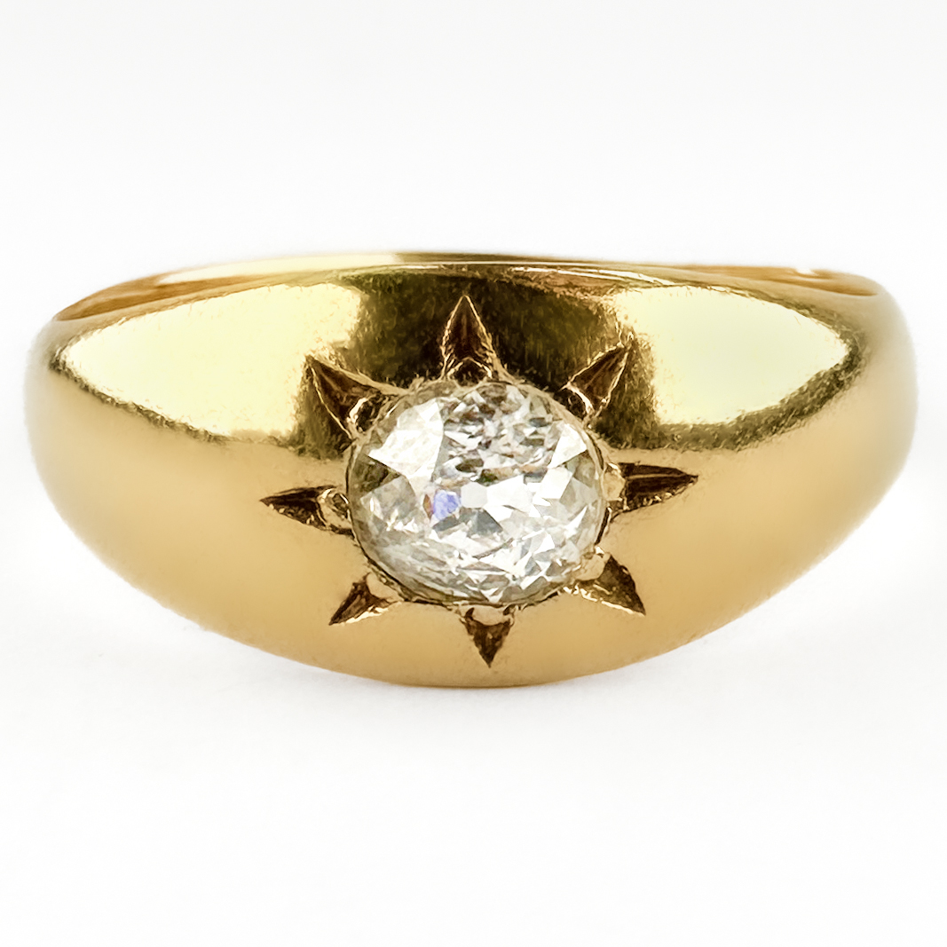 Victorian Single Stone Diamond Gypsy Ring. A gorgeous Victorian diamond gypsy ring crafted in rich 18ct yellow gold, set with a 0.40 ct Victorian brilliant-cut diamond in a classic star setting. One of the most enduring designs of the Victorian era, gypsy rings were prized for their practicality and elegant simplicity. This example features a bright old-cut diamond securely star set into the gold, creating a striking contrast between the sparkling gemstone and the warm gold mount. The broad, tapering band sits comfortably on the finger, making it as wearable today as it was over a century ago. The diamond is H-I in colour and VS2 clarity. Victorian gypsy rings have become increasingly sought after for their timeless appeal, robust construction and understated elegance. Equally suited as a unique engagement ring, signet-style dress ring or addition to an antique jewellery collection. Please contact us if you would like to know more about this lovely ring or visit us at Saddingtons Jewellery, Mayfair.