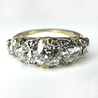 Antique Old Cut 5 Stone 2.35ct Diamond Ring.Stunning Victorian 5 stone carved half hoop ring in 18ct gold with diamond points between each diamond.The main 5 diamonds are all beautifully cut late Victorian transitional brilliant cut diamonds.The total weight is 2.35 carats of diamonds.The centre diamond weighs 0.90cts,the clarity of the diamonds are Vs,colour H-I.A beautiful antique ring, it sits low and comfortable on the finger.This ring can be resized if required.Please contact us if you would like to know more about this ring.