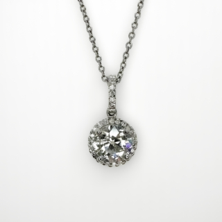 Stunning 1.58ct Halo Diamond Pendant.Set in platinum. The central claw set natural old cut diamond is 1.58ct weight of diamond, colour H-I, clarity SI2. The diamond has a grain set halo of of smaller diamonds set in the platinum mount also to the pendant bale.The drop from the top of the bale to the bottom of the pendant is 2cm. A chain is not included with this pendant,however we can provide a platinum chain with price on request at added cost to the pendant price. Please contact us if you would like more information on this beautiful pendant.