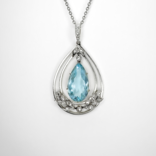 Fabulous Antique Pear Drop Aquamarine Diamond Pendant.The central claw set pear drop aquamarine is delicately set in a 15ct yellow gold gallery. It is link suspended to the top of the pendant framework by one chain link,above a rub over set rose cut diamond,above this stylised platinum leaves with 2 rose cut diamonds. Surrounding the central aquamarine is encircled by 2 graduated platinum pear shaped mount and at the bottom of this beautiful mount a central small rub over rose cut diamond with diamond set platinum leaves to each side. The fine bale also has pave set rose cut diamonds. The pendant has really beautiful movement when wearing on the neck giving a gentle added sparkle. The pendant measures 1.5 inches from the top of the bale to the bottom of the pendant. The chain shown is not included with the purchase, we can provide a suitable chain/length of chain required on request. Please contact us if you would like more information on this beautiful pendant.