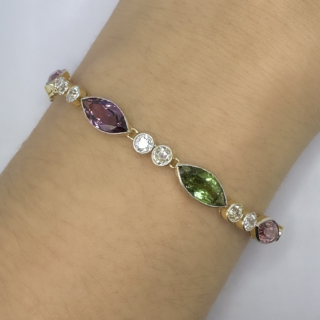 Unique Antique Multi Gem & Diamond Bracelet. Edwardian antique bracelet with stunning marquis shaped rub over multi gems spaced with 2 old cut diamonds between each colourful gem. Please contact us if you would like to know more about this bracelet or visit us at Saddingtons Jewellery, Mayfair.