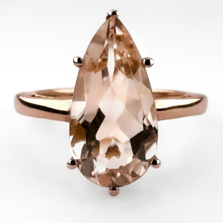 Pretty Pear-Shaped Morganite Rose Gold Ring. Contemporary pear-shaped morganite ring crafted in 9ct rose gold. The ring is centred with a beautiful pear-cut morganite displaying delicate blush peach-pink tones, elegantly highlighted by the warm colour of the rose gold setting. The simple claw-set mount allows the stone to remain the focal point while giving the ring a refined and modern silhouette. Feminine and understated, morganite has become increasingly sought after for its soft romantic colouring and elegant wearability, making this ring ideal as a statement dress ring or alternative engagement ring. Please contact us if you would like to know more about this gorgeous ring or visit us at Saddingtons Jewellery, Mayfair.