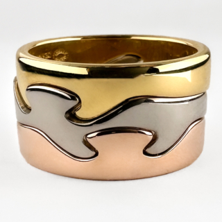 Georg Jensen Fusion 3 Ring Stack. This Iconic stack has 3 18ct gold tricolour bands that seamlessly interlock. The organic wave like bands 'fuse' together to create a contemporary and interesting design. These rings were designed by Nina Koppel who was commissioned by Georg Jensen. All 3 bands feature full Georg Jensen hallmarks including a Denmark stamp, N K stamp and 750 gold stamp. These yellow, rose and white gold rings can be worn together or separately. Please contact us if you would like to know more about this beautiful ring stack or visit us at Saddingtons Jewellery, Mayfair.