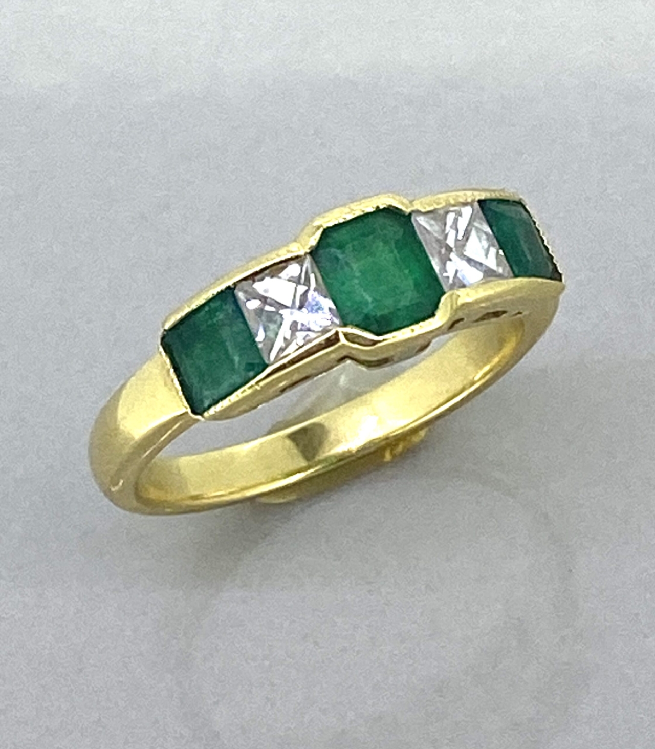 Emerald and Diamond Half Hoop Ring in 1§8 Carat Gold Ring Size M