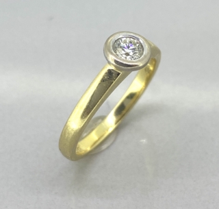 Vintage Diamond Ring has a rub over setting with the brilliant cut solitaire single stone diamond