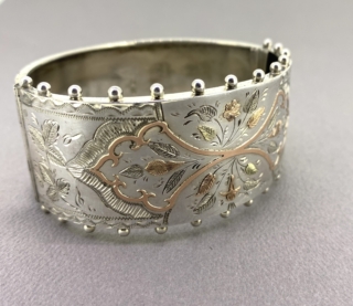 Wide Victorian silver and gold overlay bangle. Beautifully decorated leafy pattern. Hallmarked 1884