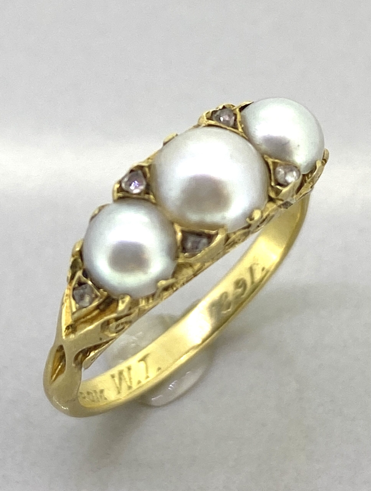 Victorian 3 pearl ring. Natural Pearls beautifully and intricately carved half hoop ring with rose diamond points.  There is a 'betrothal' inscription 'L.P. from W.T 1891'. This is a stunning unique antique ring,  We offer a tailored individual service with support and advice to ensure your satisfaction. Free resizing, shipping and valuations on every purchase.  Contact us for further details or videos