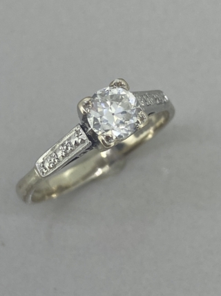 Square Cut Brilliant Diamond Solitaire ring with just over half a carat of diamond 0.55 points. Set in 18 carat white gold.