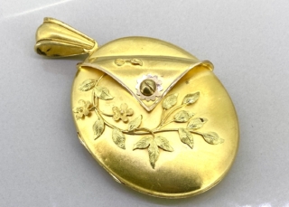 Victorian Gold Large Oval Locket. A rare example in 15ct gold with applied decoration and designed as a turned over cuff