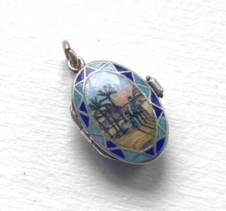 Art Deco Moses Basket Charm, beautifully enamelled moses basket charm with a boy on a camel scene. Inside is a gilt silver 'baby'. Art Deco and in perfect condition