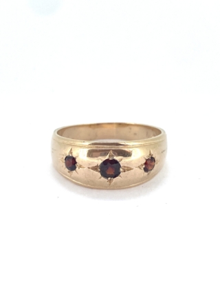 Gypsy Garnet Gold Ring in 9ct gold. The gorgeous buttery gold ring has 3 deep red garnets set in gypsy style setting. The ring is large size X an a half. It can be resized within 2-4 sizes only. It is clearly hallmarked.