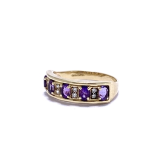 This Gold Amethyst Stacking Ring is 9ct and tapers from front to back. The face is rectangular with alternating 4-prong set purple Amethysts and flush micro Diamonds.