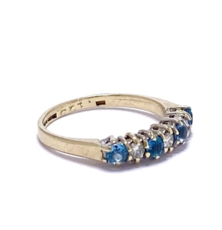 Ocean Blue Topaz and Diamond claw set half eternity ring in 9ct gold.