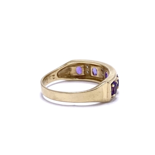 This Gold Amethyst Stacking Ring is 9ct and tapers from front to back. The face is rectangular with alternating 4-prong set purple Amethysts and flush micro Diamonds.