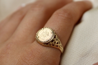 Mexican Gold Coin Ring set in 9ct hallmarked with styled pierced shank signet design.  The ring has a London Hallmark.