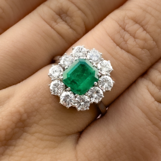 vintage emerald & diamond cluster in plat ring on hand