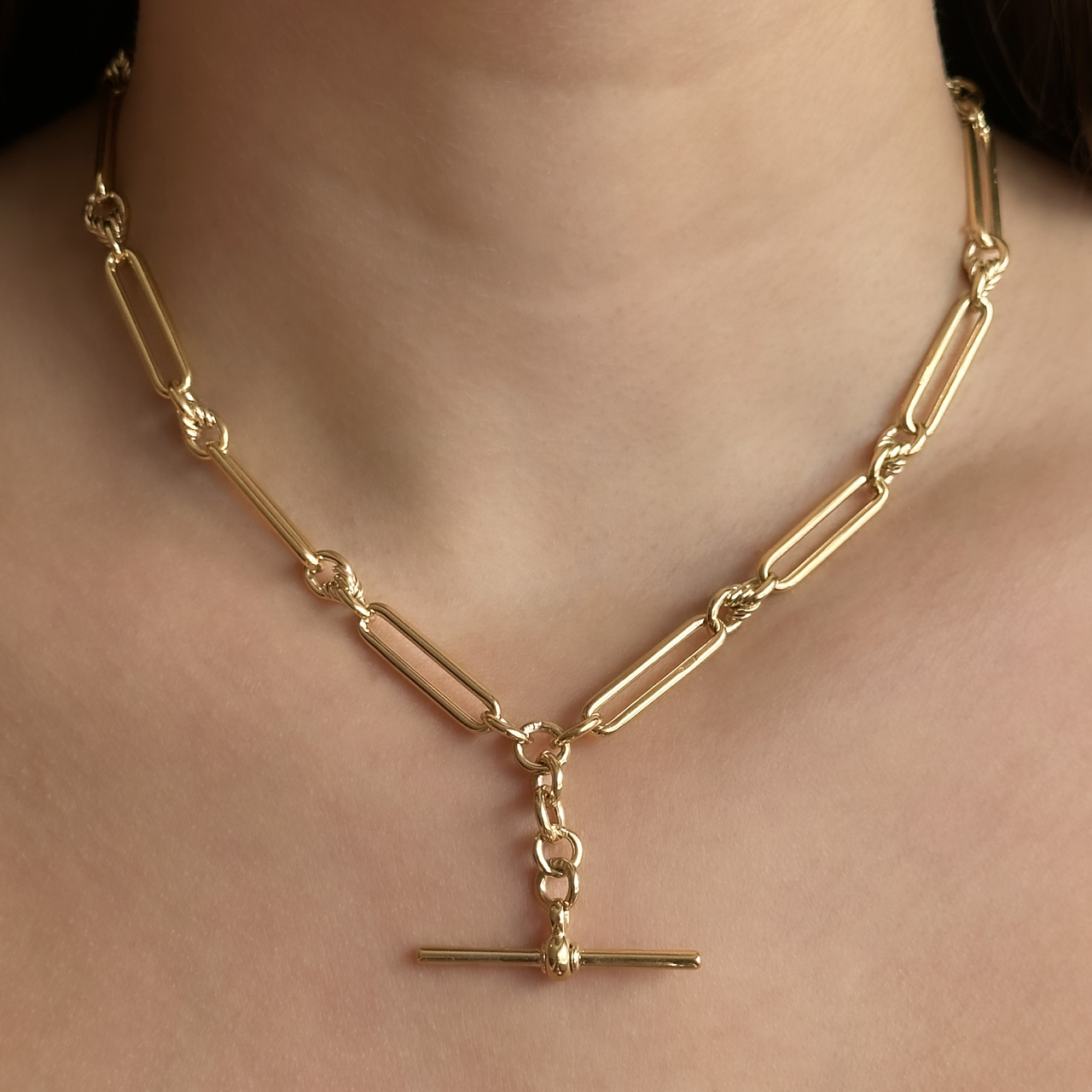 Edwardian 16.5" trombone & knot link Albert chain 9ct gold on neck