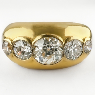Stunning 1950's 5 Stone Diamond Ring 2.15ct. The amazing ring features 5 graduating round transitional Edwardian diamonds rub over set in 18ct yellow gold. The central diamond is 1.20cts, the total diamond weight is 2.15cts. The sparkly diamonds are G in colour and VS2 clarity. The ring is chunky and robust, it would look great as part of a stack or as a statement piece. Please contact us if you would like to know more about this incredible ring or visit us at Saddingtons Jewellery, Mayfair.