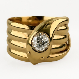 Stunning Old Cut Diamond Coiled Snake Ring. This antique ring is crafted from 9ct yellow gold and features a elegant coiled design rising to a central snake head set with a striking 0.55ct old cut Victorian diamond. The snake wrap motif was very popular in late Victorian and Edwardian jewellery, symbolising eternity and strength. The ring features a Chester hallmark and is dated to 1909. This ring combines sculptural design with romantic brilliance from the bring diamond. The diamond is G-H in colour and VS clarity. Please contact us if you would like to know more about this beautiful ring or visit us at Saddingtons Jewellery, Mayfair.