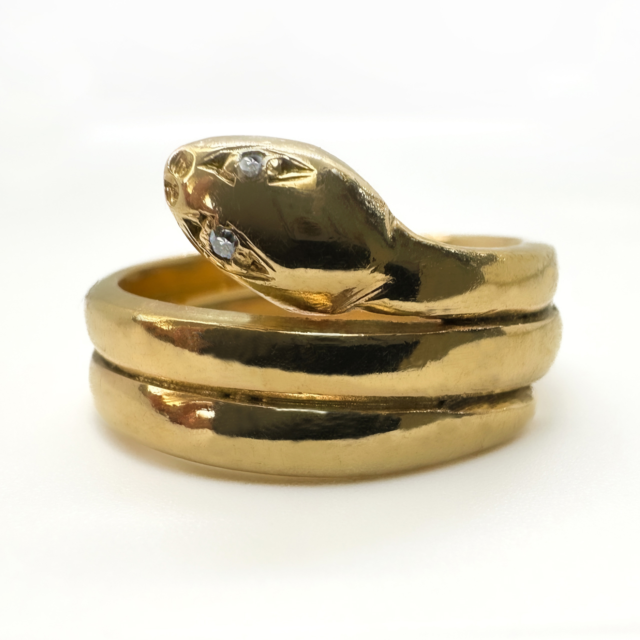 Coiled Gold Coiled Snake Ring With Old Cut Diamond Eyes.A gorgeous polish finish two coiled antique snake ring with engraved face detail.9ct marked in inside of the shank.