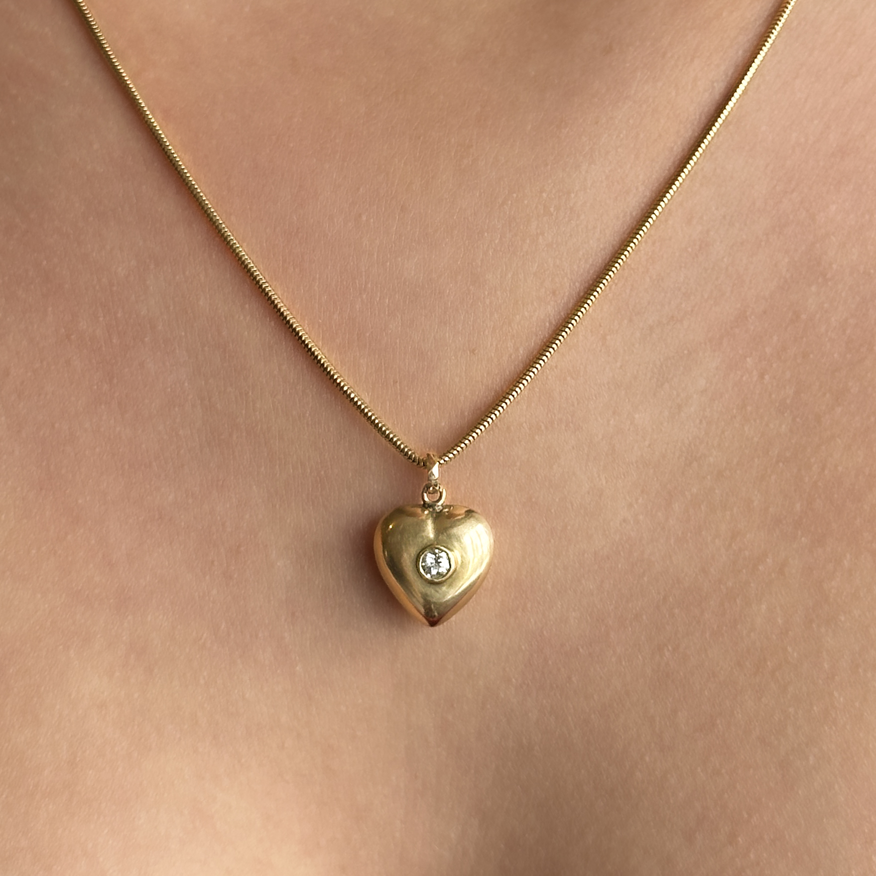 Diamond Set Gold Heart Pendant on neck close up