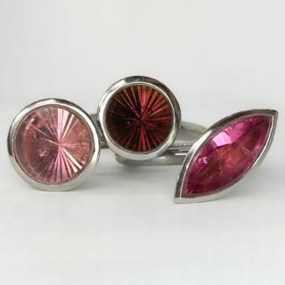 Desirable Designer Louise O'neill Tourmaline Stacking Rings. There are 3 individual rings in this set, beautifully handcrafted rings in 18ct white gold. All with the  Louise O'neill makers mark, London 2008. Each ring has a beautiful tourmaline in a rub over setting, each ring has a shade of pink tourmaline from tones, light pink, vibrant pink and finally deep pink. Each head of the ring different, there are 2 circular settings one slightly smaller than the other. There is also a marquise shape in the vibrant pink. The rings are able to be worn interchangeably to create your own style. When worn together they are a true statement set. Please contact us if you would like to know more about this fantastic set or come and see them at Saddingtons Jewellery, Mayfair.