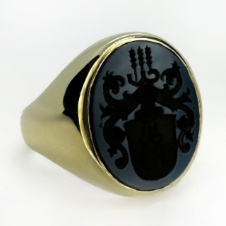 Chunky Antique Crest Intaglio Ring.A fabulous statement antique ring.The carved intaglio onto black sardonyx has a shield with ancient figures and wheat sheafs.The head of the ring is'Oxford' oval shape and measures 1.8cm x 1.4cm.The shank is chunky and weights 11.2gms.The ring can be resized.Please contact us if you would like more information on this statement ring.