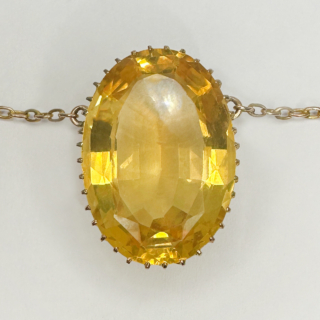 Golden Citrine Antique Pendant, claw set in 9ct yellow gold (unmarked tested). The beautiful glowing citrine is faceted (2.3cm x 1.7cm) with integral 9ct yellow gold chain (40cm/15.5inches}. The pendant sits well at the base of the neck. Please contact us for further information on this beautiful pendant and integral gold chain.