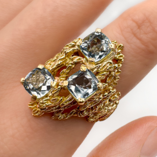 Vintage Large Aquamarine Textured Gold Ring.Beautifully bark textured three stone pale aquamarine asymmetric statement ring,stunning.The three aquamarines are faceted square stones which are claw set.The head of the ring measures 2.8 x 1.5cm with a tapering bark textured shank.There is a makers mark 'CJltd' inside the shank and is marked 9ct.A stylish, gorgeous fun ring.