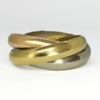 Early 1980's Trinity Cartier Ring. The Trinity Cartier, Paris 3 gold intertwining white, yellow and rose gold band has the Cartier signature and the makers lozenge on the inside of the yellow band with the ring size 52. Please contact us if you would like to know more about this Cartier ring or visit us at Saddingtons Jewellery, Mayfair.