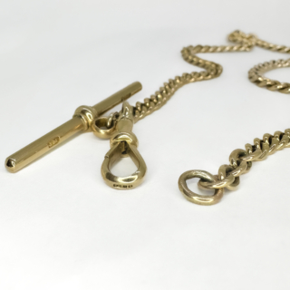 Desirable Antique Albert Chain 12.5 Inches Long. The chain is a 9ct flat curb chain with a T-Bar with a 1cm drop. The T-Bar and dog clip fastener have a 9ct mark and makers mark 'J.M.' Every link of the chain has 9ct mark. There is a securing link at the end of the chain for the dog clip to attach to secure. The chain can be worn as a wrap around bracelet of can be worn as an Albert chain to wear a watch on a waistcoat. Desirable Antique Albert Chain 12.5 Inches Long. The chain is a 9ct flat curb chain with a T-Bar with a 1cm drop. The T-Bar and dog clip fastener have a 9ct mark and makers mark 'J.M.' Every link of the chain has 9ct mark. There is a securing link at the end of the chain for the dog clip to attach to secure. The chain can be worn as a wrap around bracelet of can be worn as an Albert chain to wear a watch on a waistcoat